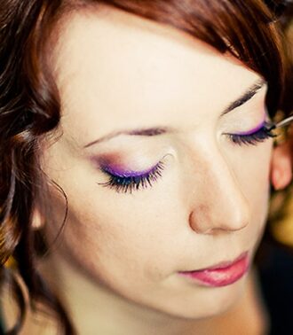 Woman receiving makeup application, Viasun cosmetics theme